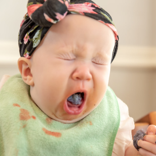 What causes a baby to choke while crying?