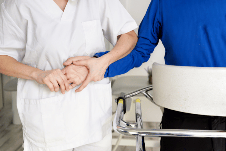 Physiotherapist assisting a patient with Amyotrophic Lateral Sclerosis. 